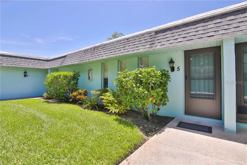 4160 Fruitville Road, Unit 5 Sarasota, FL 34232 - Photo 1 of 1 a front view of a house with garden