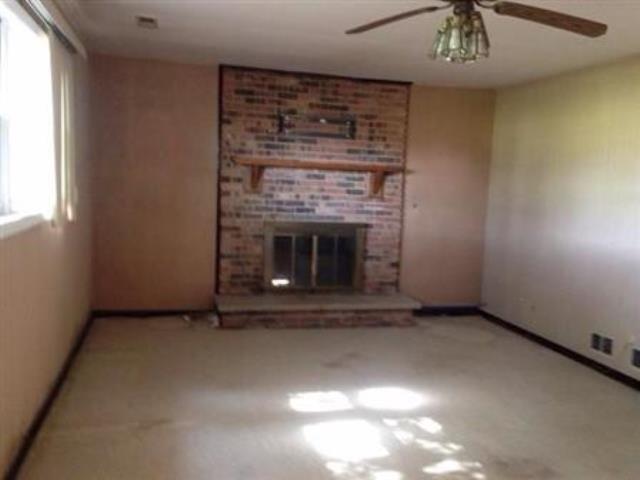 730 Cornfield Road Matteson, IL 60443 - Photo 12 of 12 an empty room with windows and fireplace
