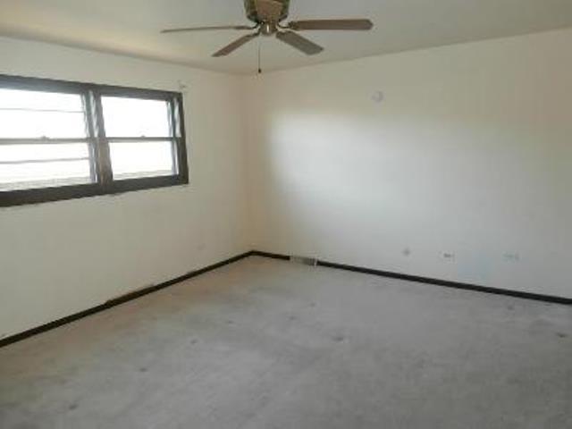 730 Cornfield Road Matteson, IL 60443 - Photo 3 of 12 an empty room with a window