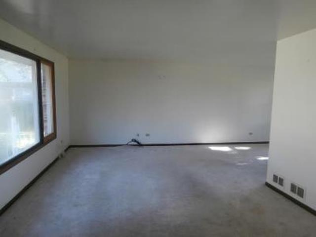 730 Cornfield Road Matteson, IL 60443 - Photo 6 of 12 a view of an empty room with a window