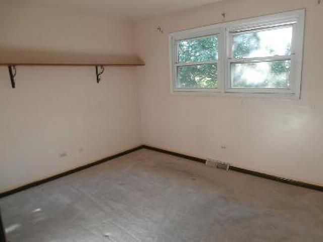730 Cornfield Road Matteson, IL 60443 - Photo 8 of 12 an empty room with a window