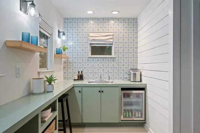 a kitchen with a sink and wooden cabinets