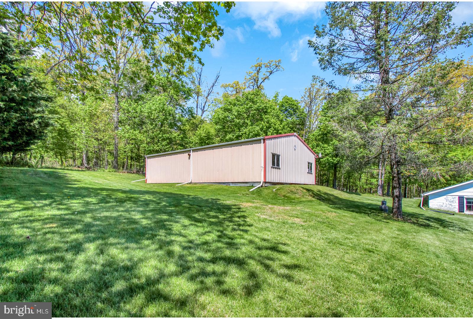 596 Rockville Road Spring Grove, PA 17362 - Photo 14 of 44 a view of a backyard with large trees