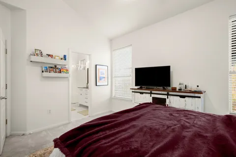 a kitchen with kitchen island granite countertop a sink appliances cabinets and a counter top space