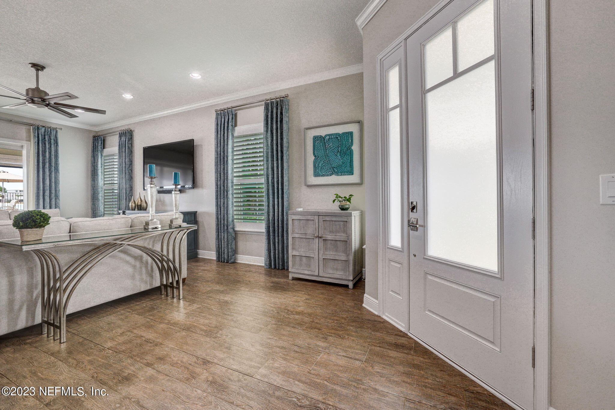 235 Rum Runner Way St. Johns, FL 32259 - Photo 23 of 108 a spacious bedroom with a bed a dresser and a large window