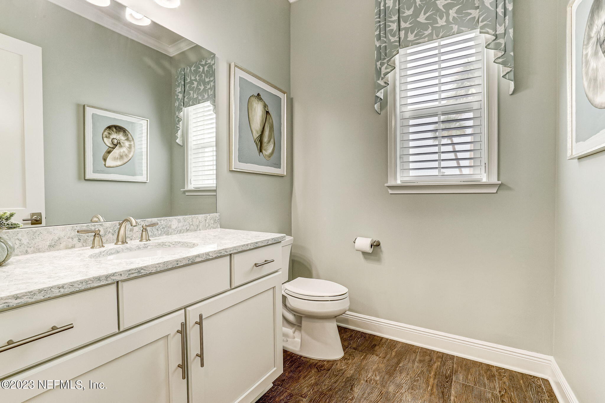 235 Rum Runner Way St. Johns, FL 32259 - Photo 34 of 108 a bathroom with a granite countertop toilet sink and mirror