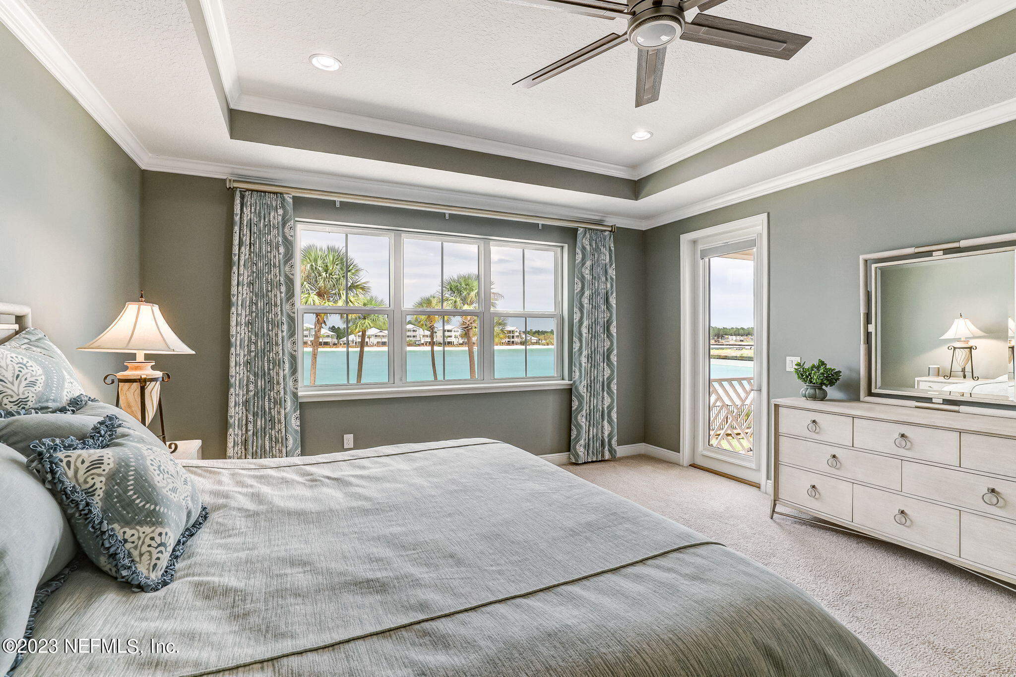 235 Rum Runner Way St. Johns, FL 32259 - Photo 46 of 108 a spacious bedroom with a large bed and a window