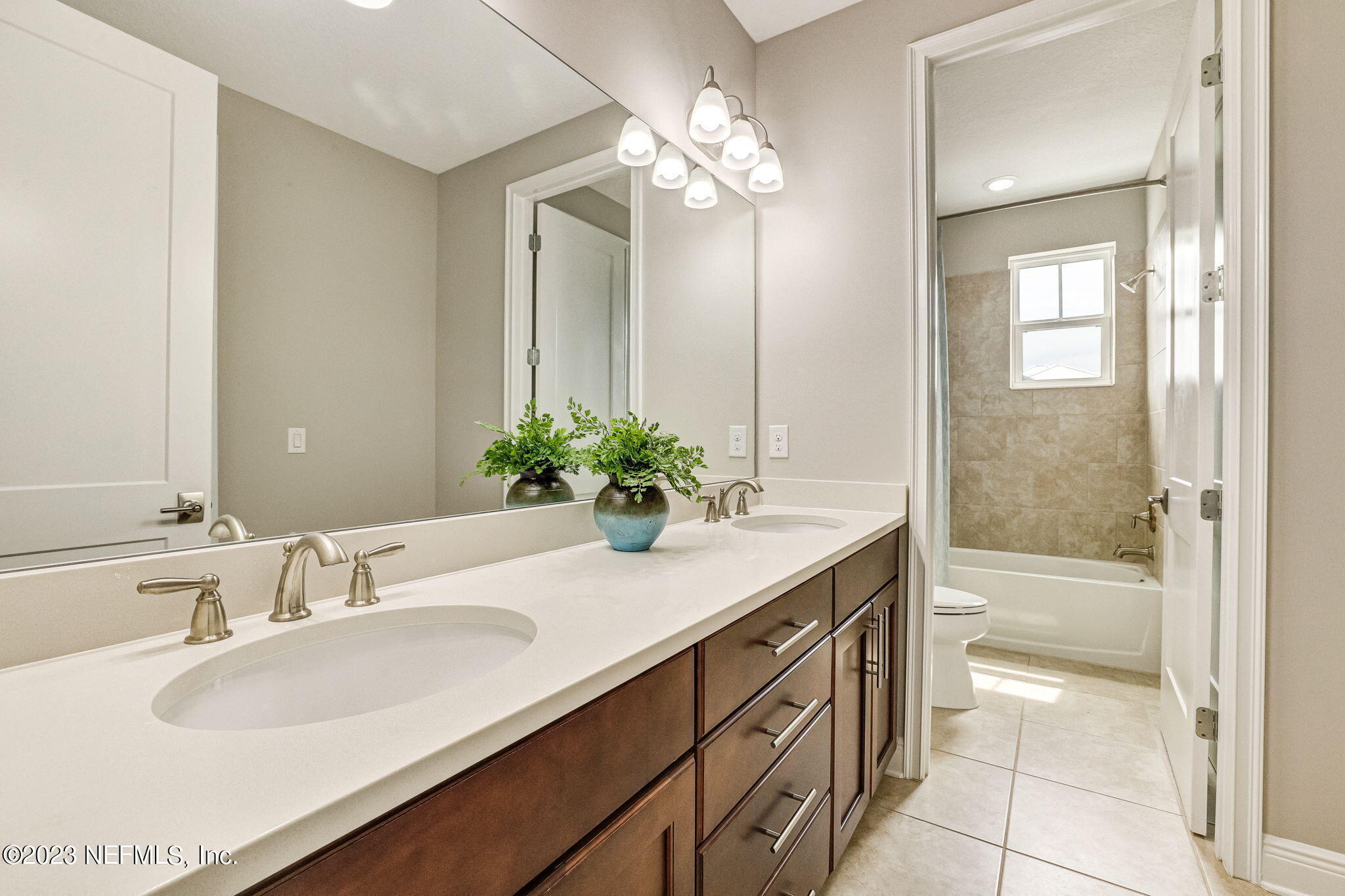 235 Rum Runner Way St. Johns, FL 32259 - Photo 55 of 108 a bathroom with a sink a vanity and a mirror