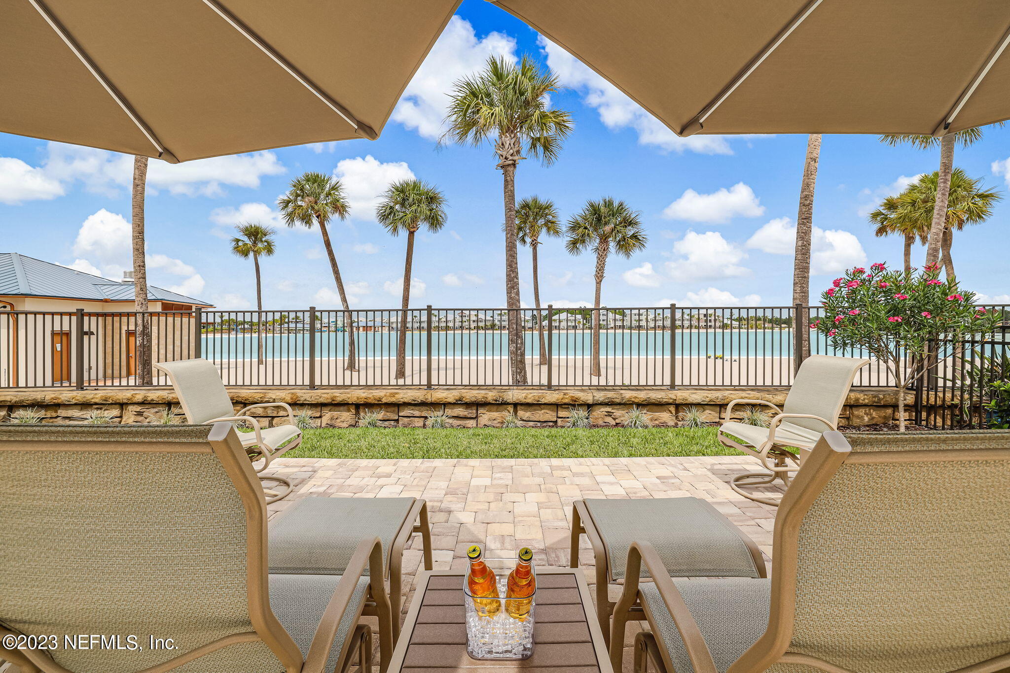 235 Rum Runner Way St. Johns, FL 32259 - Photo 6 of 108 a view of a swimming pool with a table and chairs