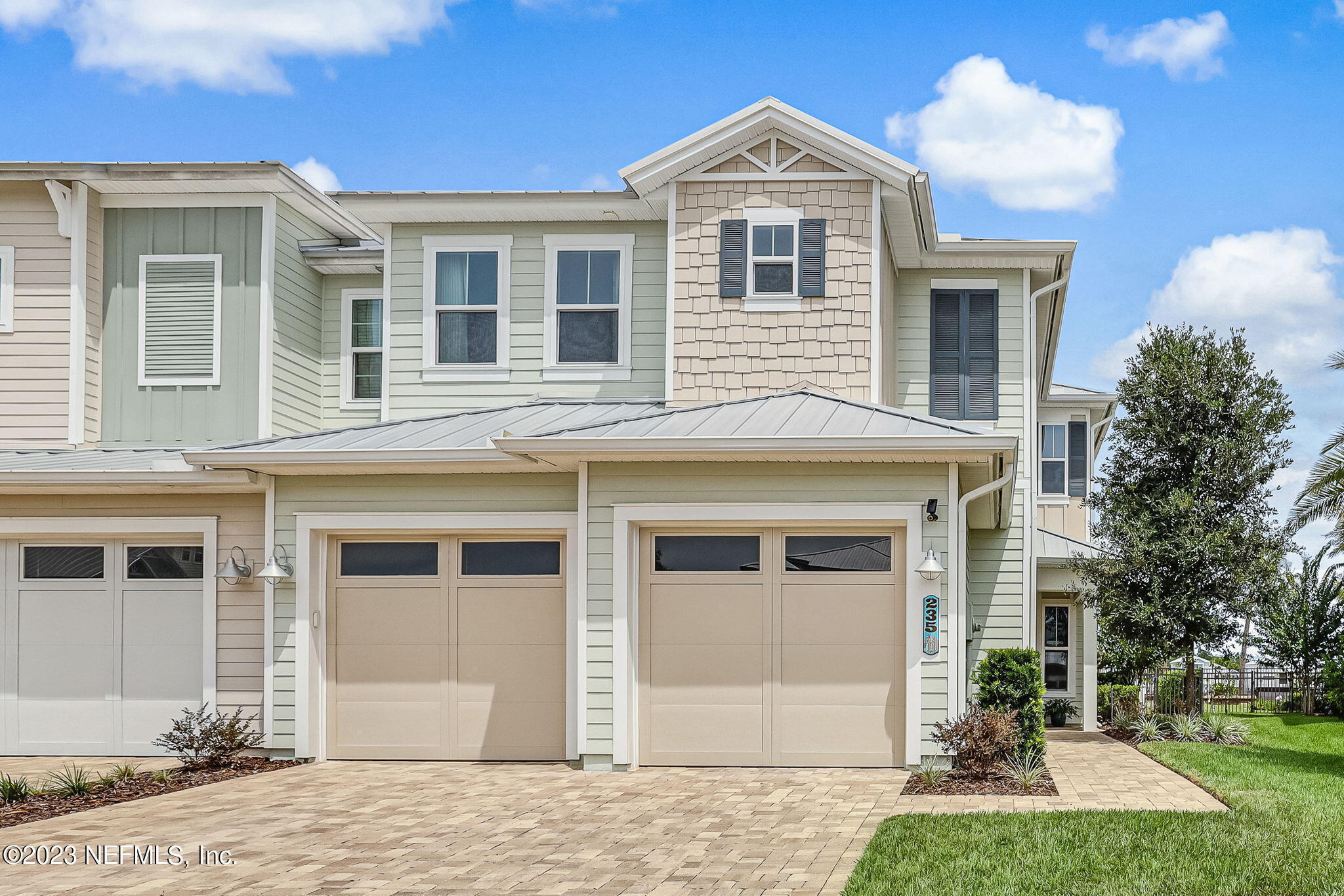 235 Rum Runner Way St. Johns, FL 32259 - Photo 9 of 108 a front view of a house with a yard and garage