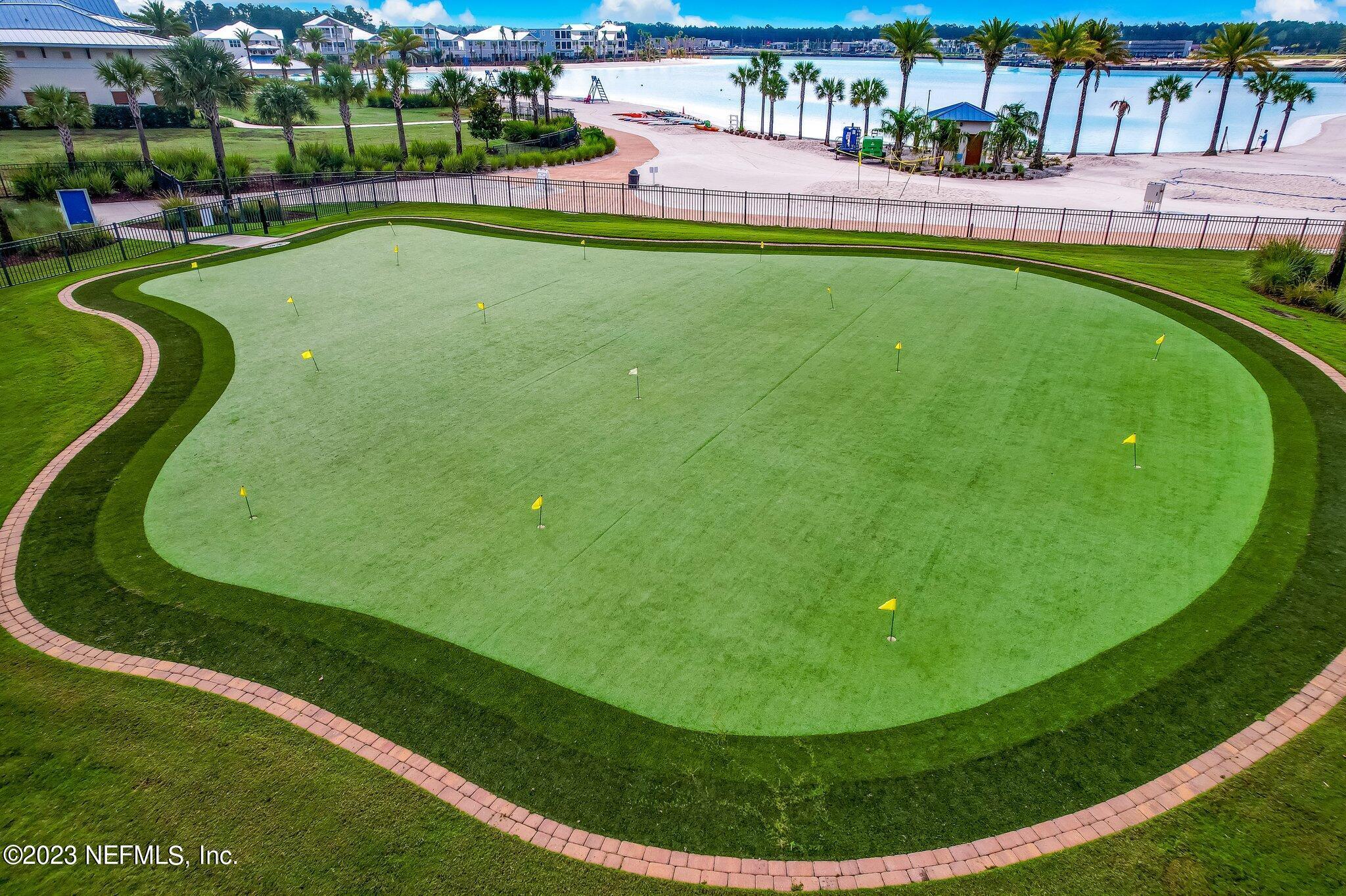 235 Rum Runner Way St. Johns, FL 32259 - Photo 99 of 108 a view of a swimming pool with a garden and sitting area