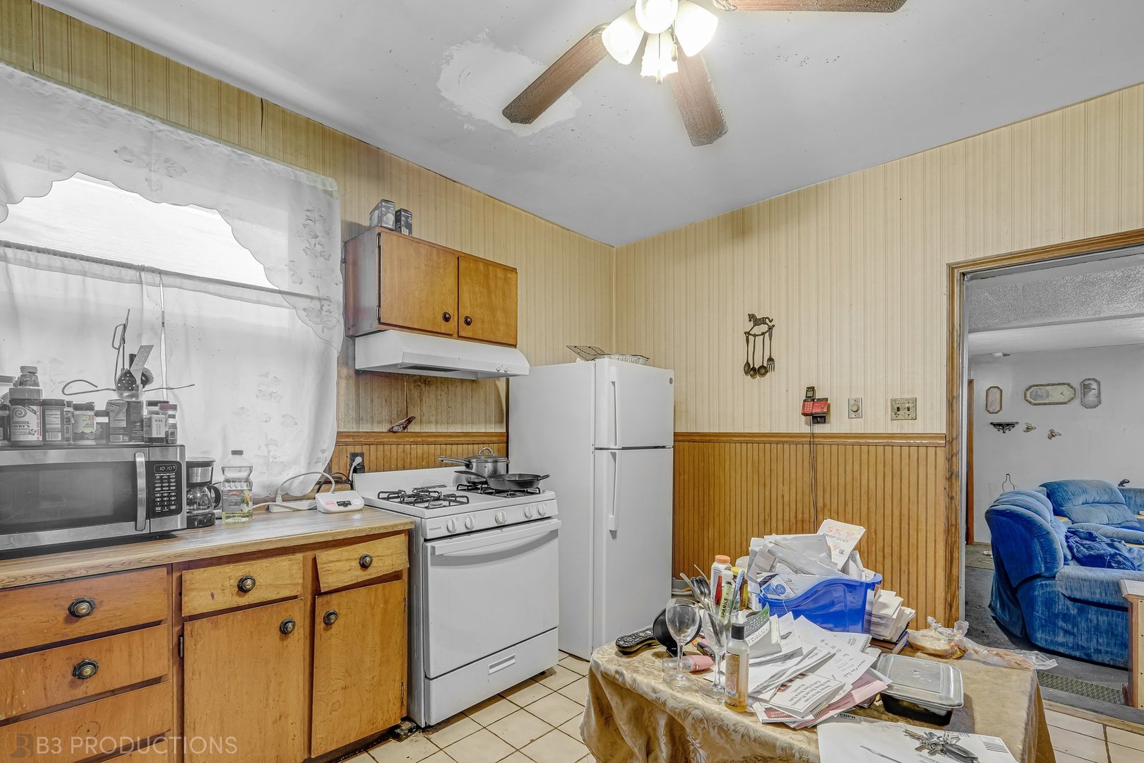 Undisclosed Address Chicago, IL 60620 - Photo 11 of 20 a kitchen with refrigerator and cabinets