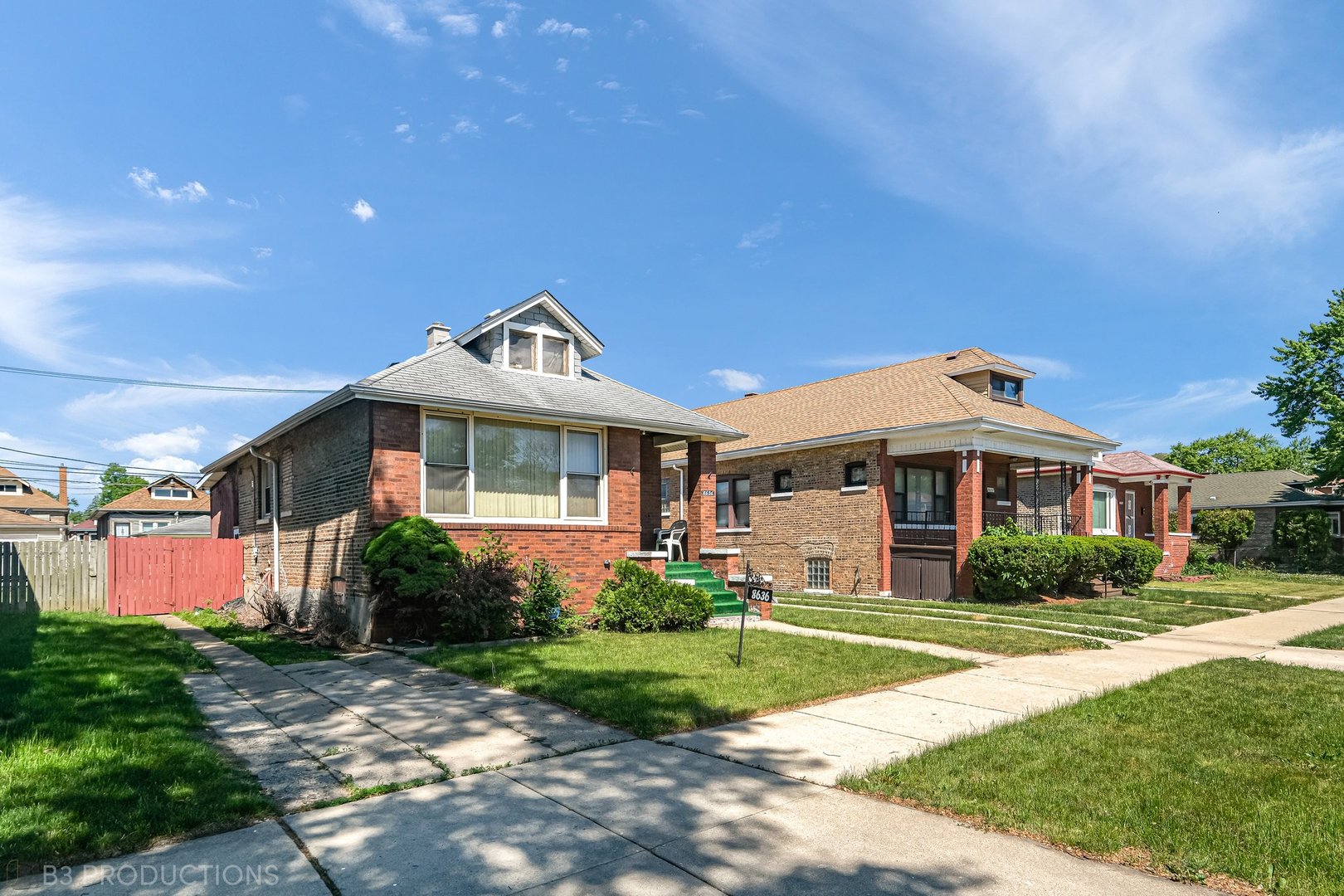Undisclosed Address Chicago, IL 60620 - Photo 2 of 20 a front view of a house with a yard