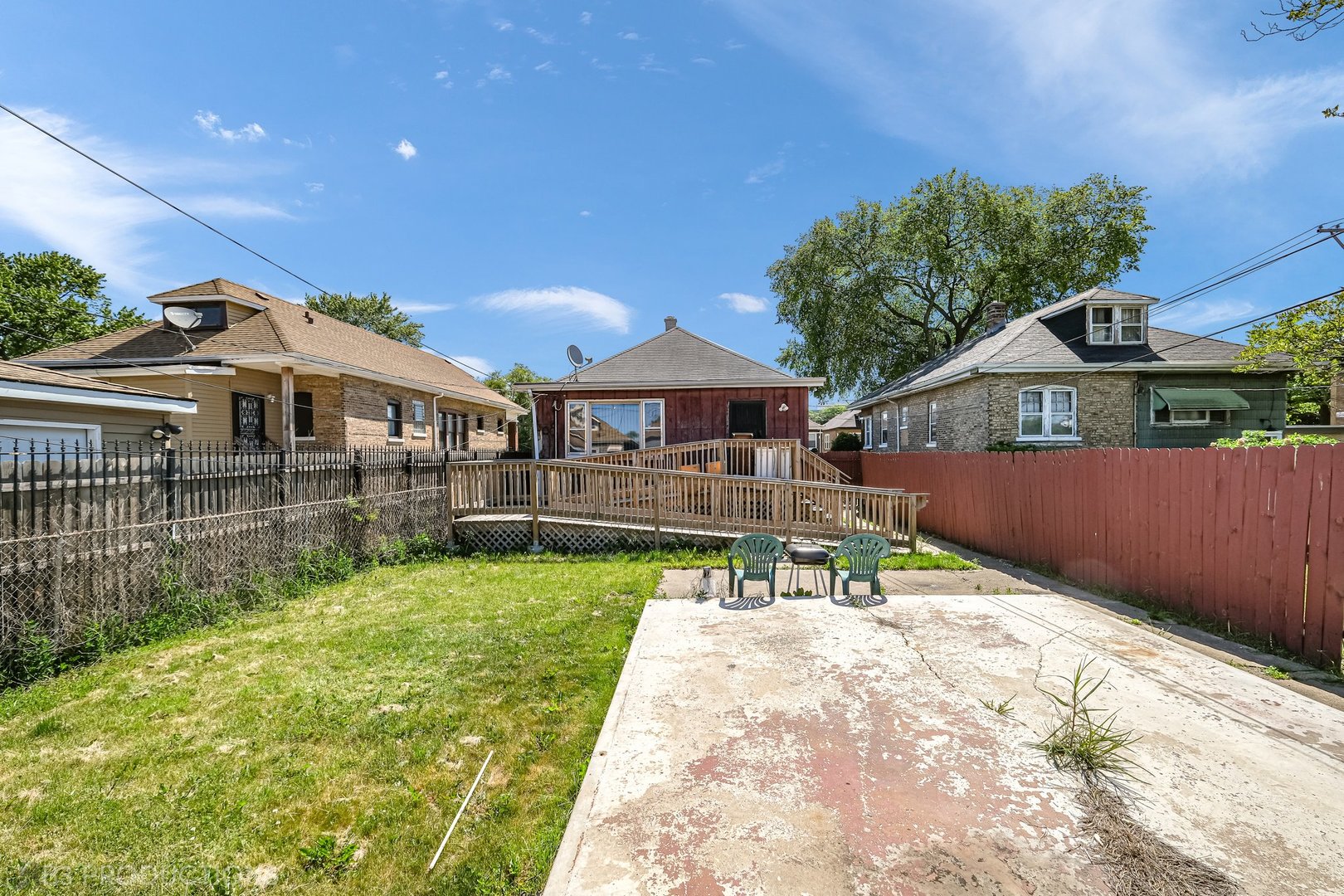 Undisclosed Address Chicago, IL 60620 - Photo 3 of 20 a front view of a house with garden