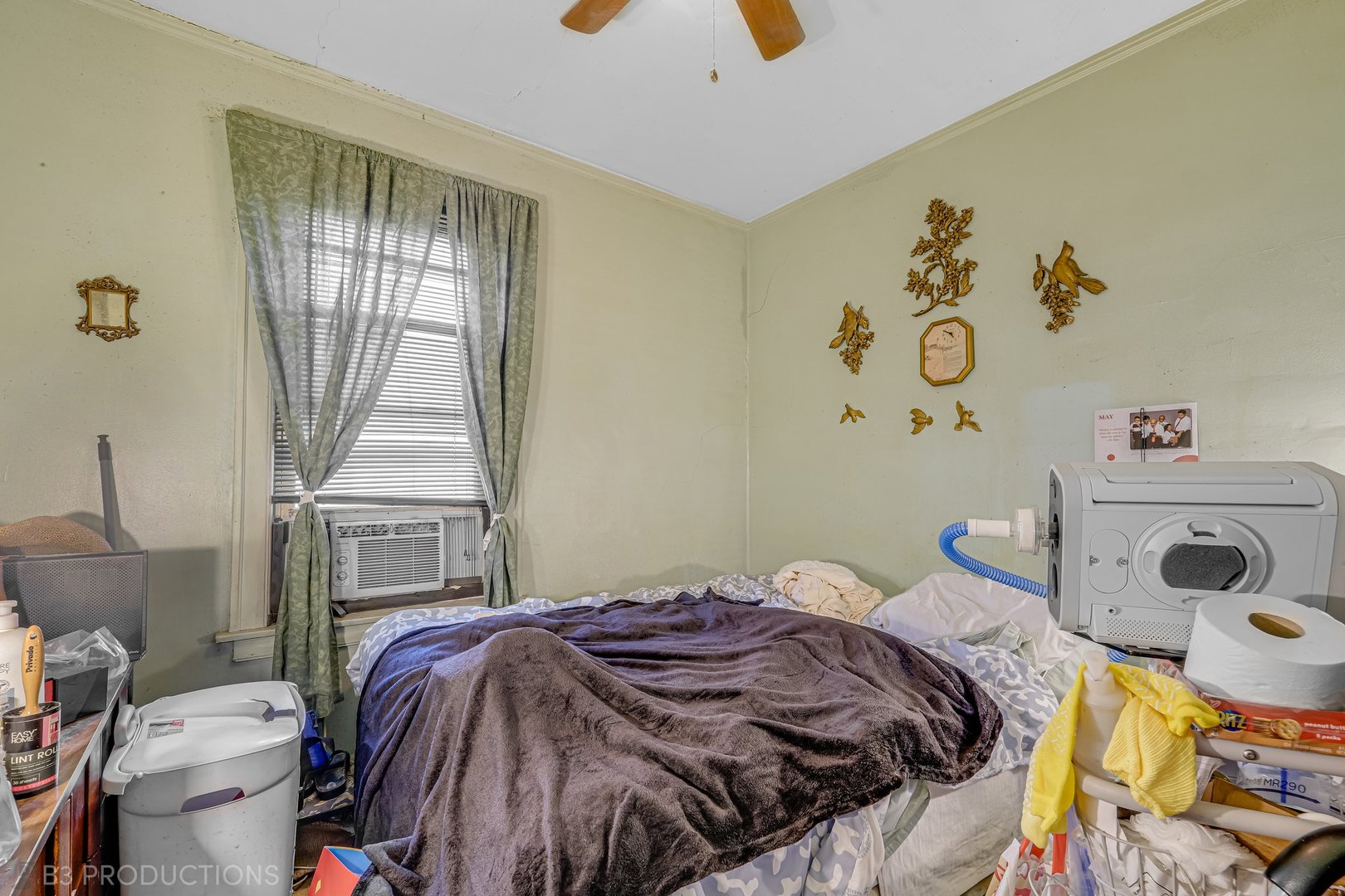 Undisclosed Address Chicago, IL 60620 - Photo 9 of 20 a bedroom with a bed and a window