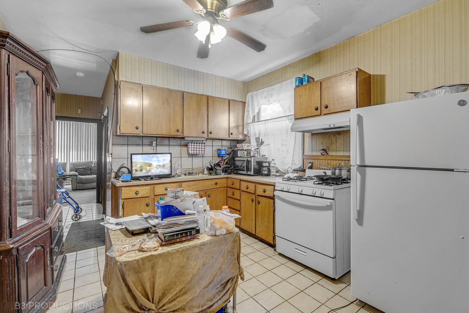 Undisclosed Address Chicago, IL 60620 - Photo 10 of 20 a kitchen with stainless steel appliances granite countertop a refrigerator sink stove dining table and chairs