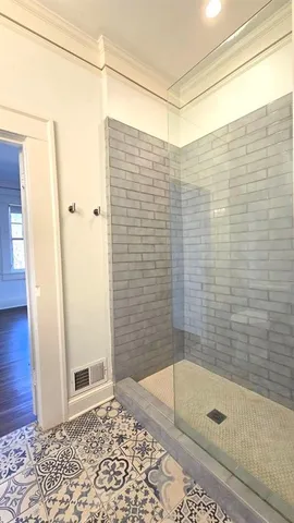 a bathroom with a bathtub and shower