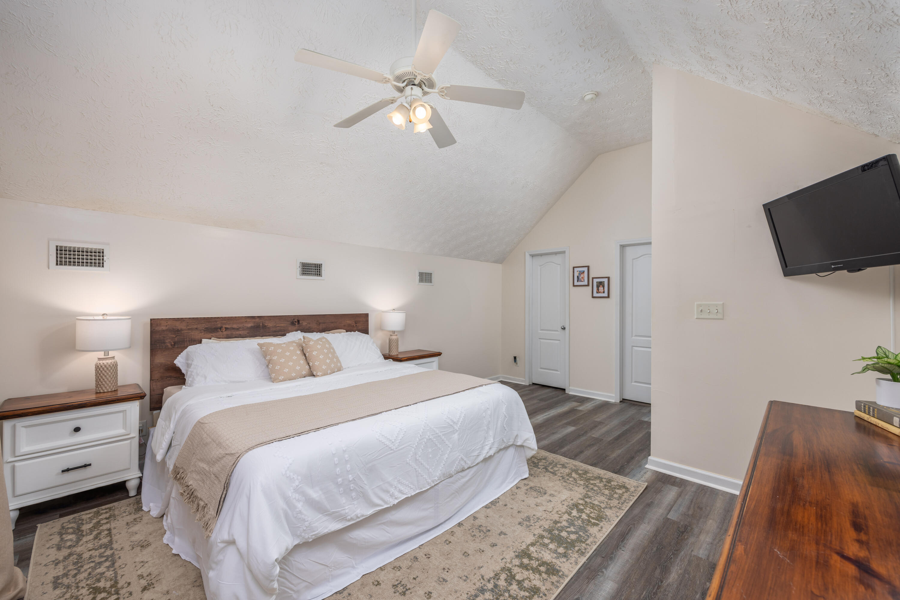 75 Mallot Beach Drive Freeport, FL 32439 - Photo 11 of 25 a spacious bedroom with a bed and a flat screen tv
