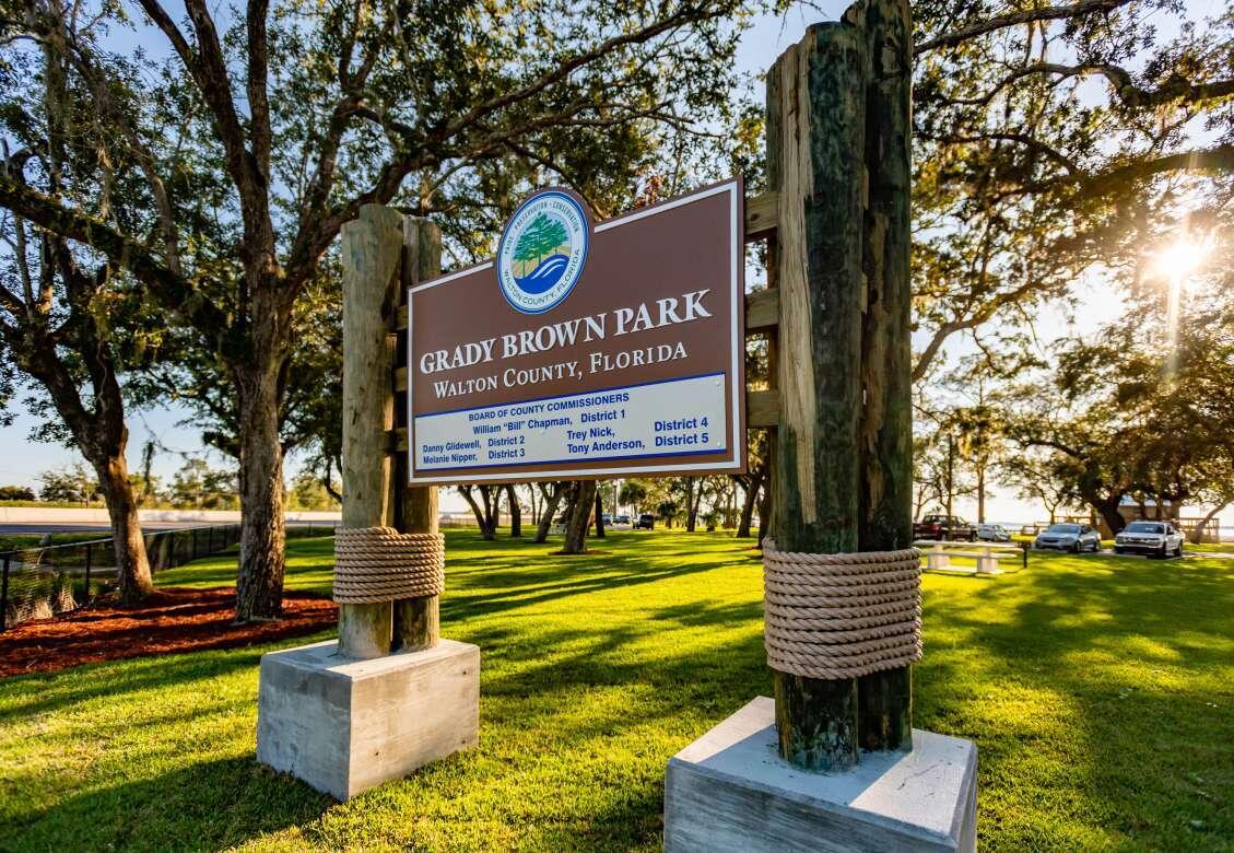 75 Mallot Beach Drive Freeport, FL 32439 - Photo 21 of 25 a sign board with a bench and trees