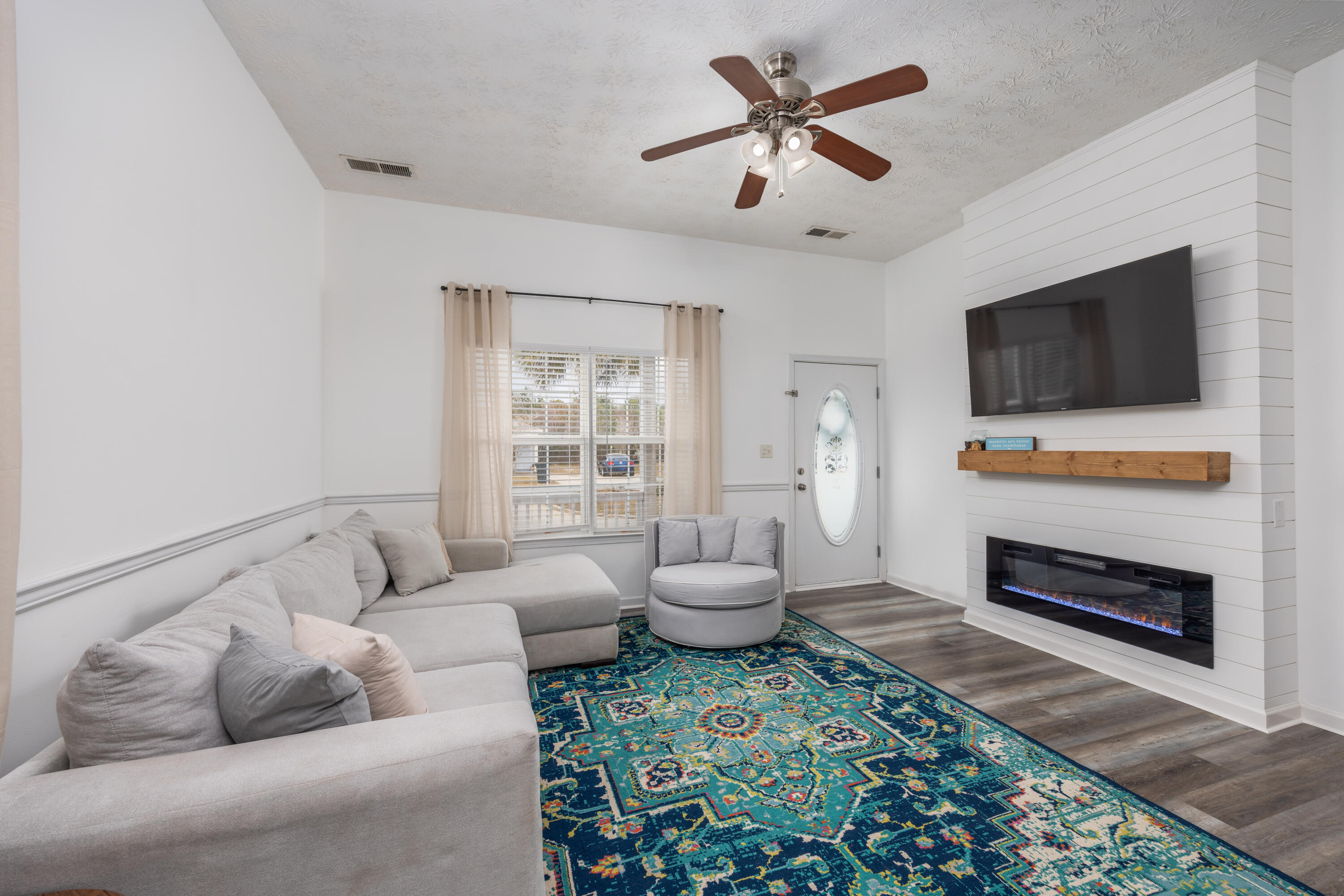 75 Mallot Beach Drive Freeport, FL 32439 - Photo 3 of 25 a living room with furniture and a flat screen tv