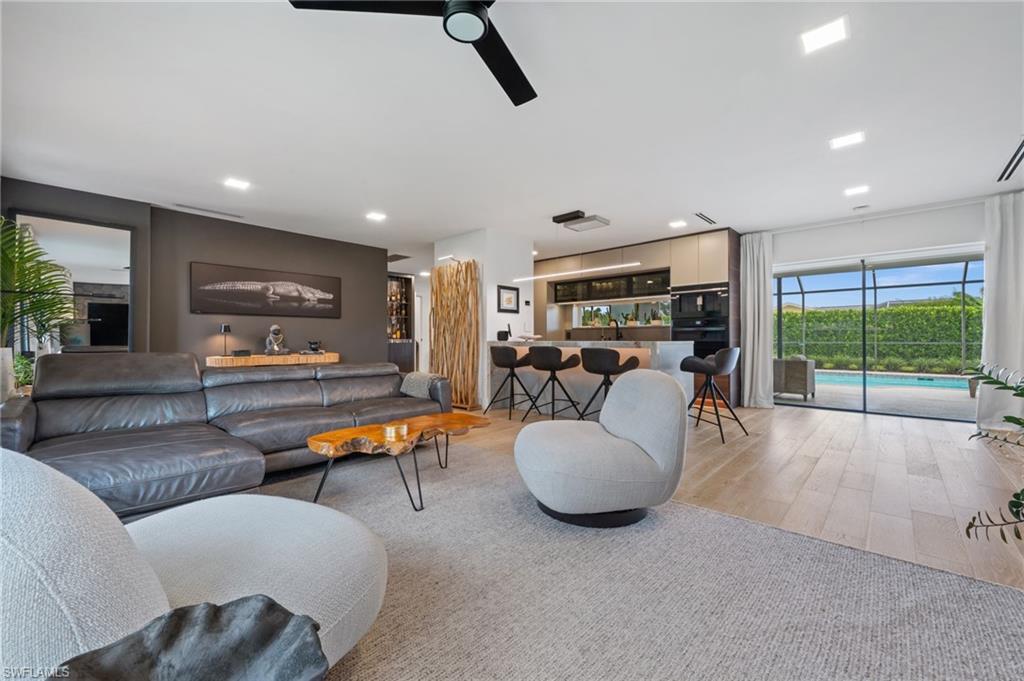304 Nason Lane Naples, FL 34112 - Photo 11 of 43 a living room with furniture and a large window