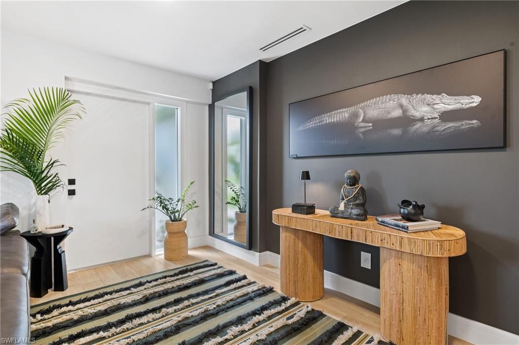 304 Nason Lane Naples, FL 34112 - Photo 16 of 43 a bath room with a sink and a mirror