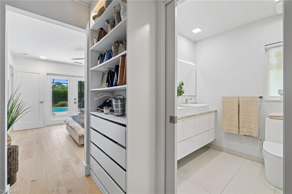 304 Nason Lane Naples, FL 34112 - Photo 20 of 43 a kitchen with a refrigerator and sink