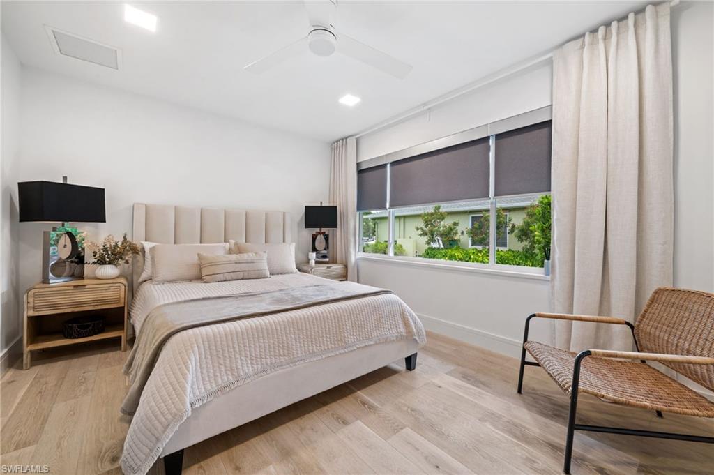 304 Nason Lane Naples, FL 34112 - Photo 24 of 43 a bedroom with a bed and large window