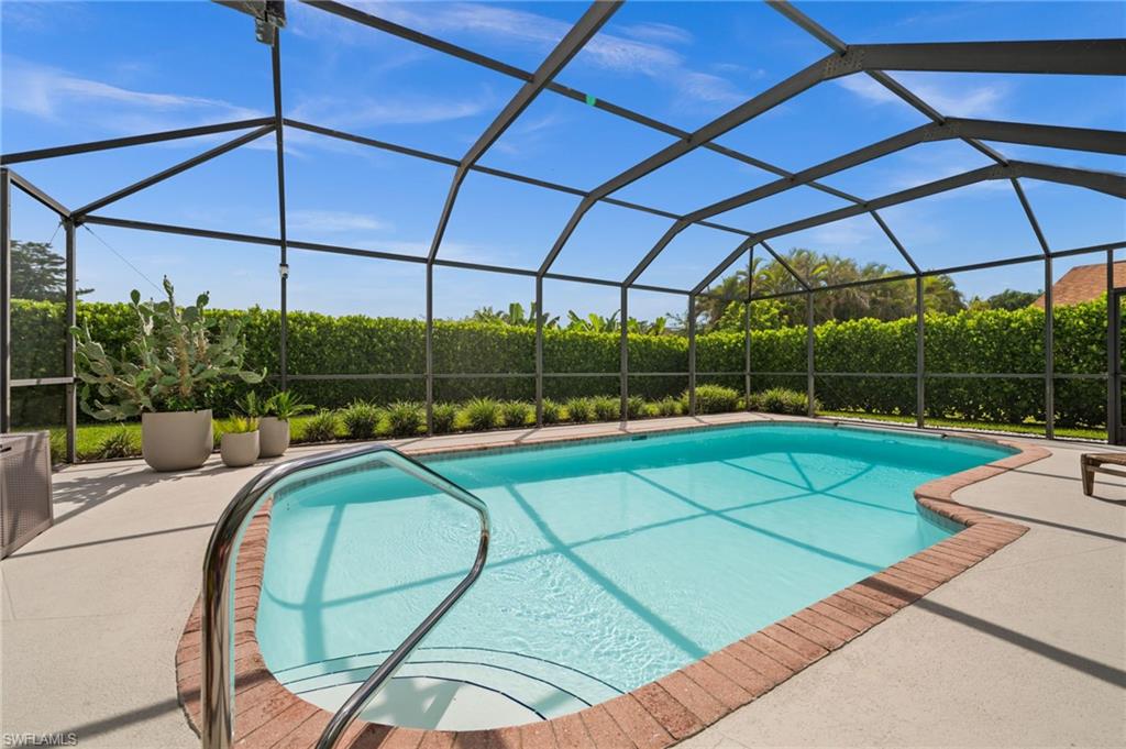 304 Nason Lane Naples, FL 34112 - Photo 33 of 43 a view of a backyard with sitting area