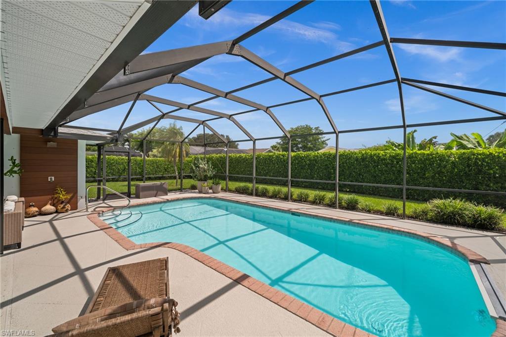 304 Nason Lane Naples, FL 34112 - Photo 36 of 43 a view of a backyard with a swimming pool