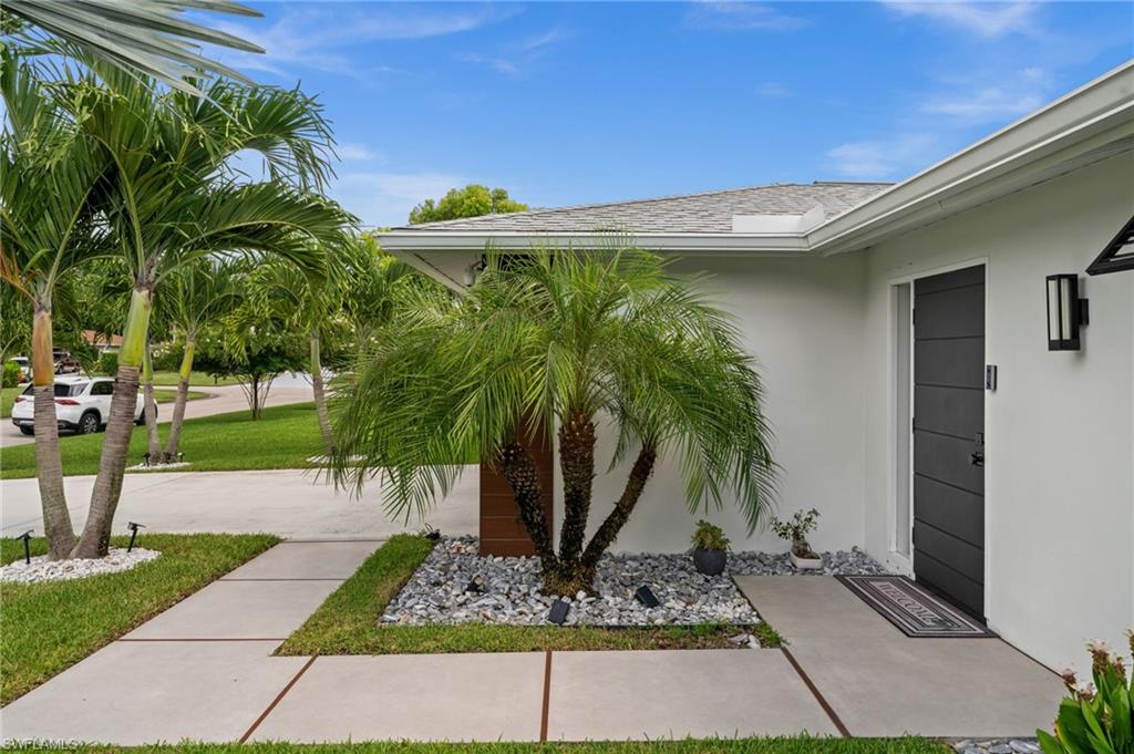 304 Nason Lane Naples, FL 34112 - Photo 40 of 43 a view of a backyard with plants