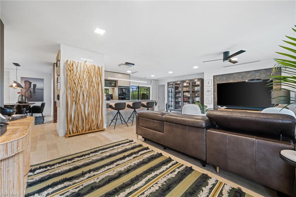 304 Nason Lane Naples, FL 34112 - Photo 4 of 43 a living room with furniture and a flat screen tv