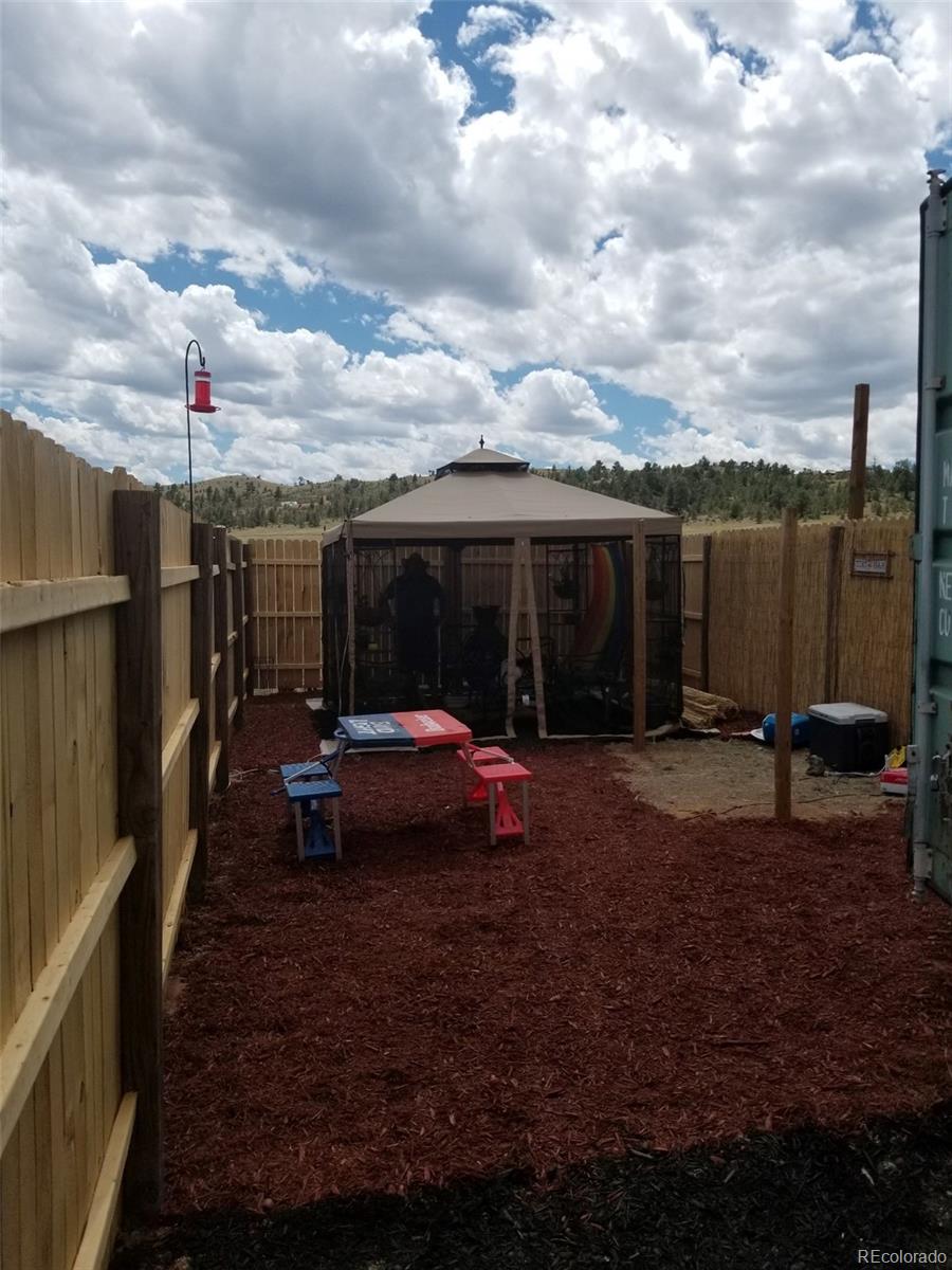 2730 Summit Road Hartsel, CO 80449 - Photo 4 of 5 a view of a house with backyard and sitting area