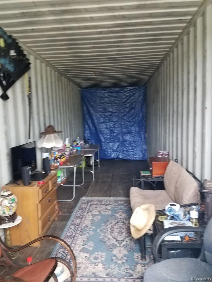 2730 Summit Road Hartsel, CO 80449 - Photo 5 of 5 a living room with furniture and a fireplace