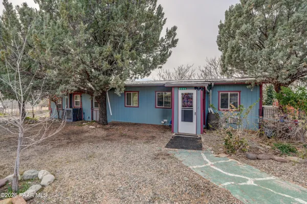 front view of a house with a trees