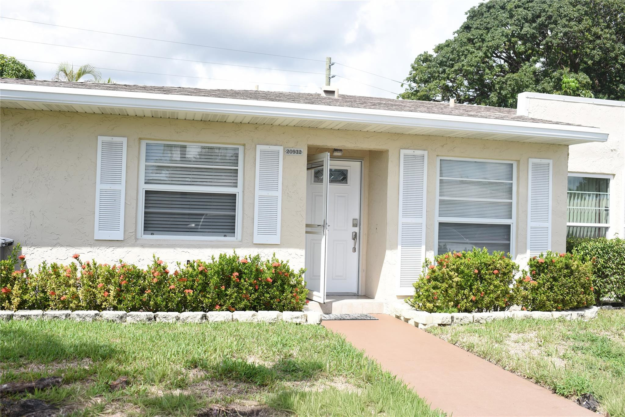 a front view of a house with a yard
