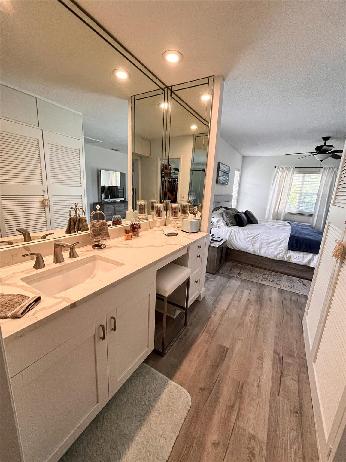 20932 Sedgewick Drive, Unit 400 Boca Raton, FL 33433 - Photo 19 of 34 a bathroom with a double vanity sink and a mirror
