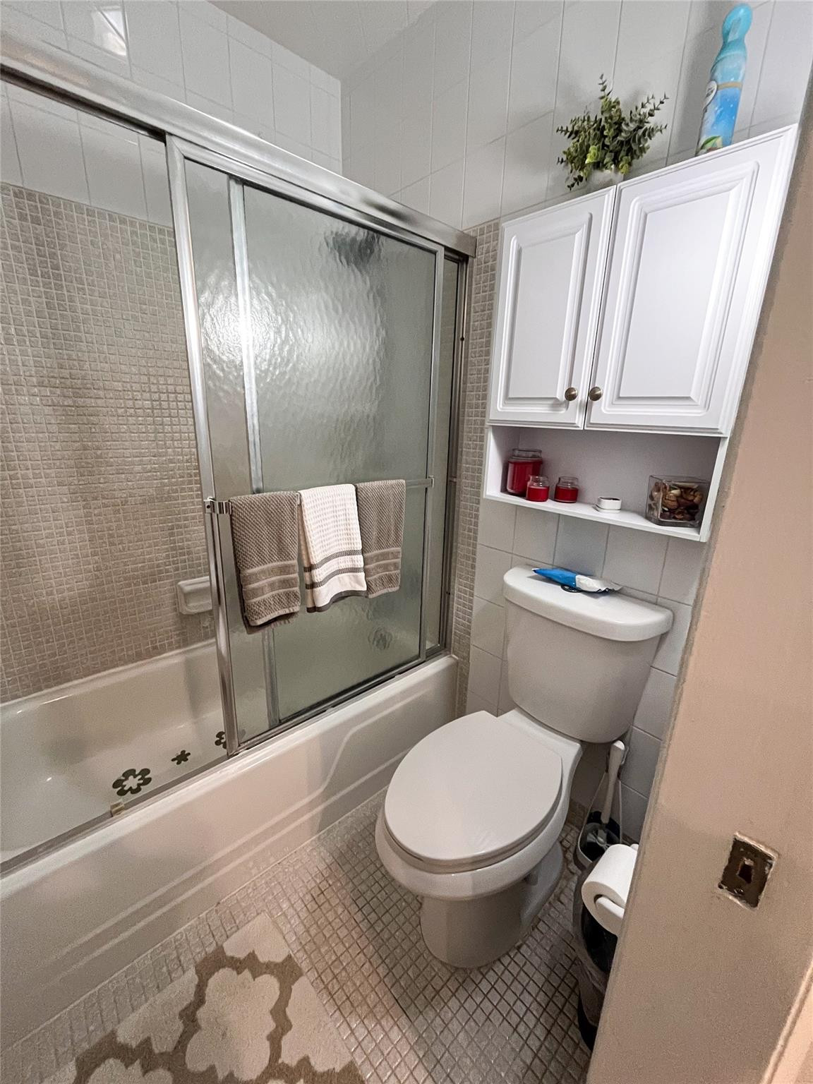 20932 Sedgewick Drive, Unit 400 Boca Raton, FL 33433 - Photo 20 of 34 a bathroom with a toilet and a shower