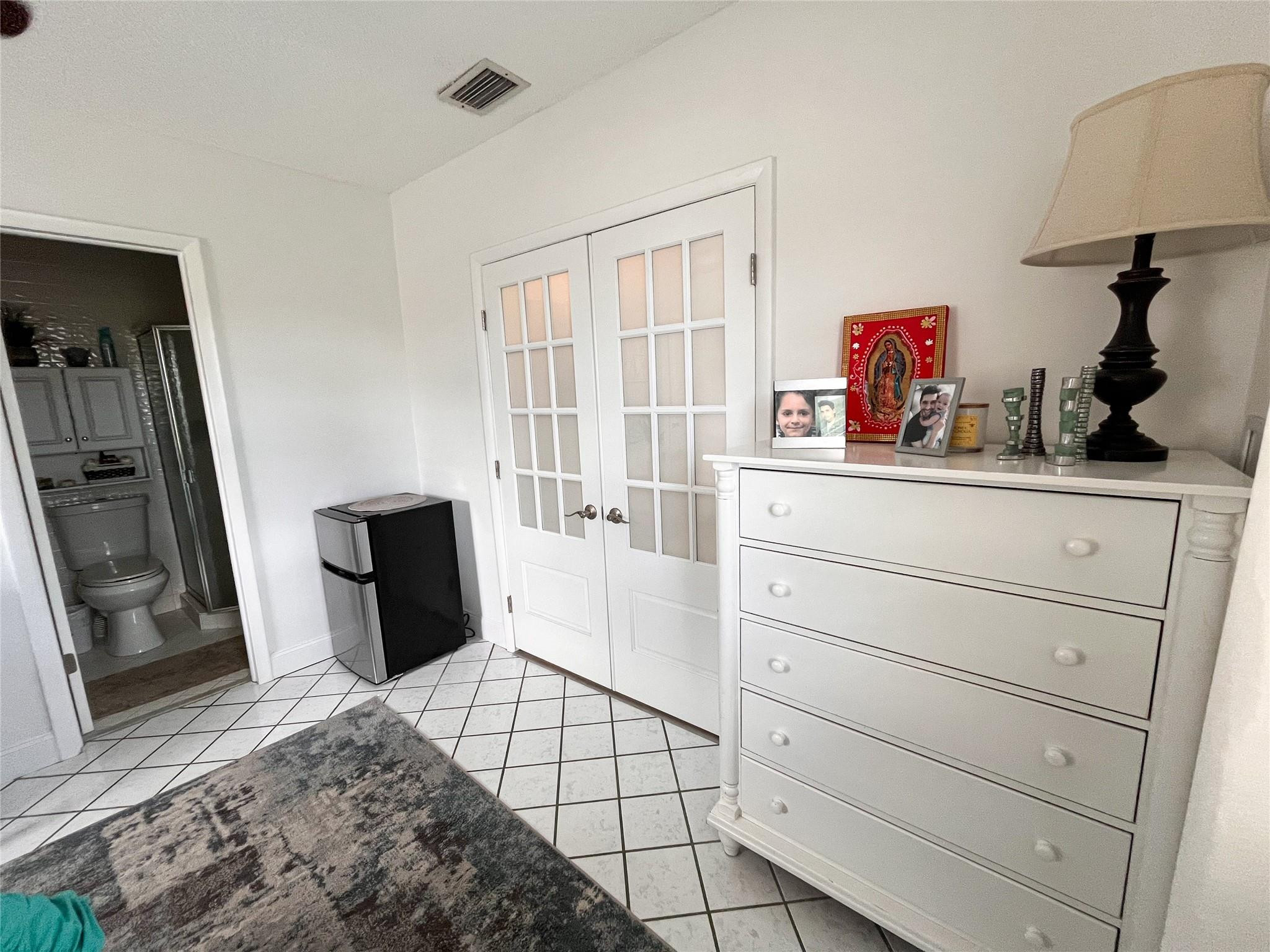 20932 Sedgewick Drive, Unit 400 Boca Raton, FL 33433 - Photo 23 of 34 a room with a dresser and a window