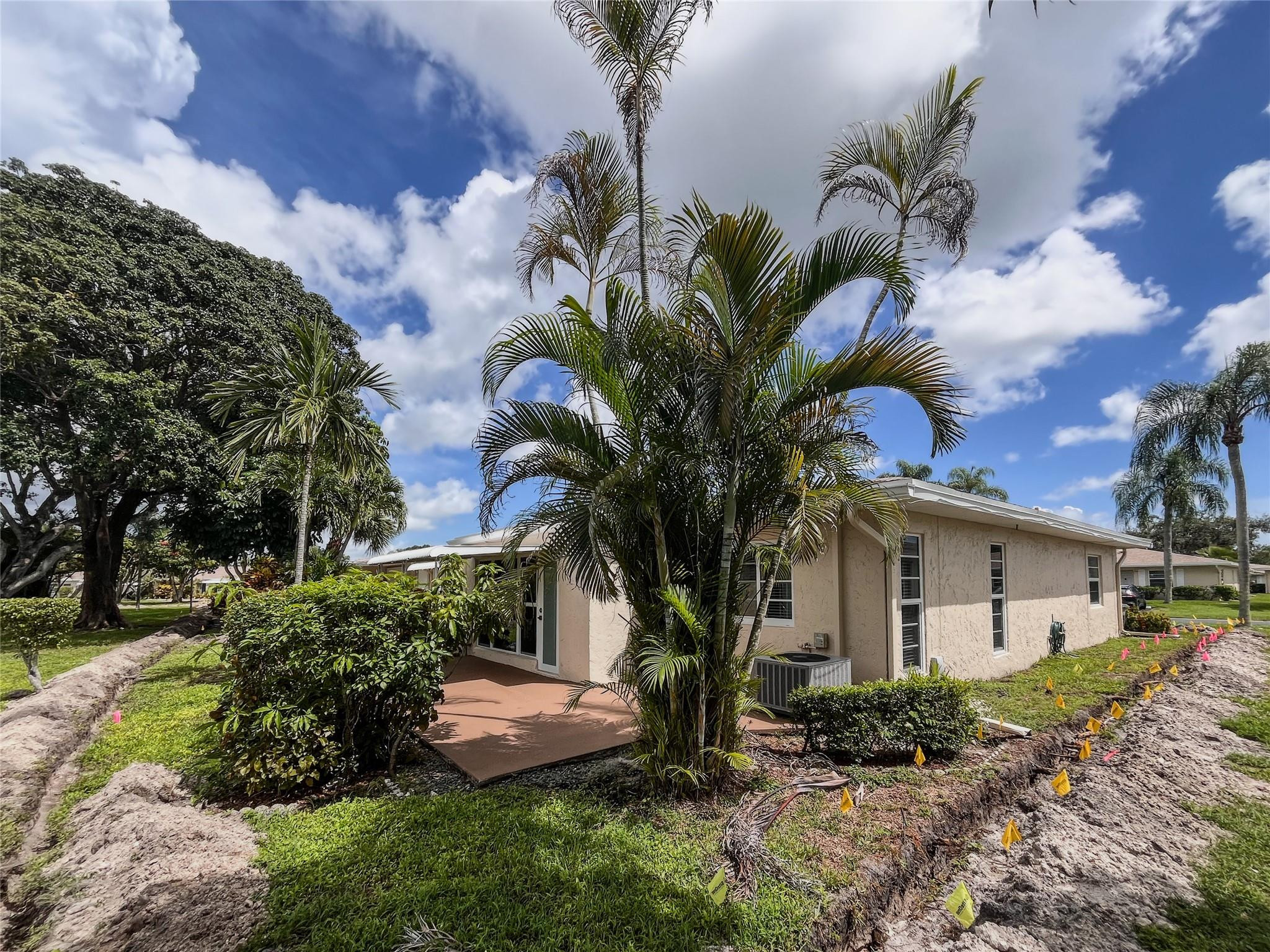 20932 Sedgewick Drive, Unit 400 Boca Raton, FL 33433 - Photo 30 of 34 a front view of a house with a garden