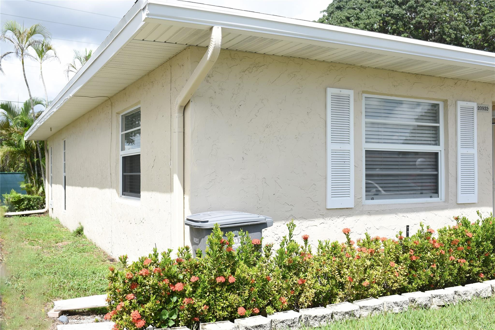 20932 Sedgewick Drive, Unit 400 Boca Raton, FL 33433 - Photo 34 of 34 a front view of a house with a yard