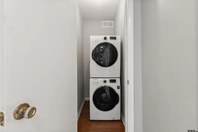 a kitchen that has a lot of cabinets a sink and appliances in it