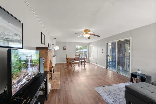 a view of a house with a backyard