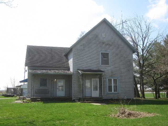3183 East 1760 North Road Sheldon, IL 60966 - Photo 1 of 15 a brick house with a yard plants and large trees