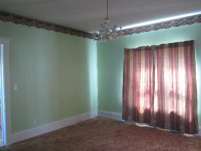 3183 East 1760 North Road Sheldon, IL 60966 - Photo 8 of 15 an empty room with windows and chandelier fan