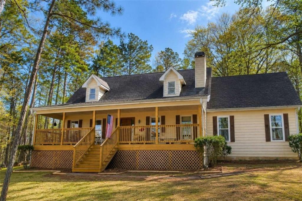 365 River Ridge Trail Oxford, GA 30054 - Photo 2 of 37 a front view of house with yard swimming pool and outdoor seating