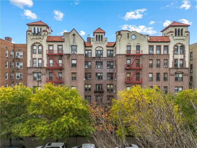 a front view of a building with garden