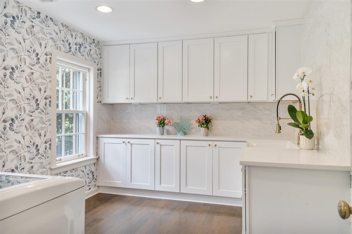 62 Woodley Road Winnetka, IL 60093 - Photo 19 of 43 a kitchen with granite countertop white cabinets white appliances and a sink