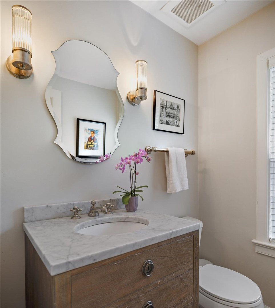 62 Woodley Road Winnetka, IL 60093 - Photo 21 of 43 a bathroom with a granite countertop sink toilet and a mirror