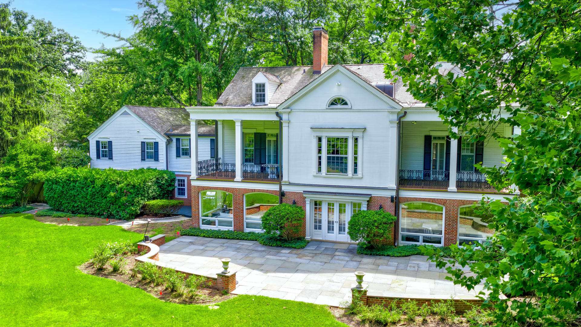 62 Woodley Road Winnetka, IL 60093 - Photo 36 of 43 a front view of a house with garden